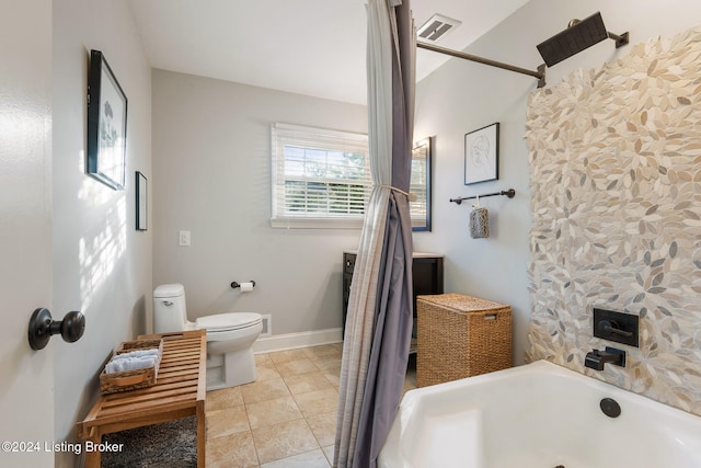 bathroom featuring tile patterned flooring, shower / bath combination, and toilet