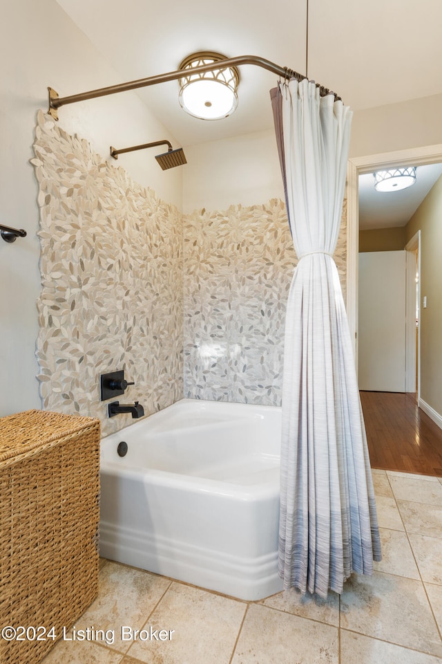 bathroom featuring shower / bath combo and hardwood / wood-style flooring