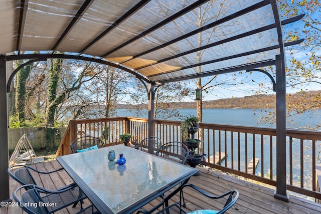 wooden deck featuring a water view