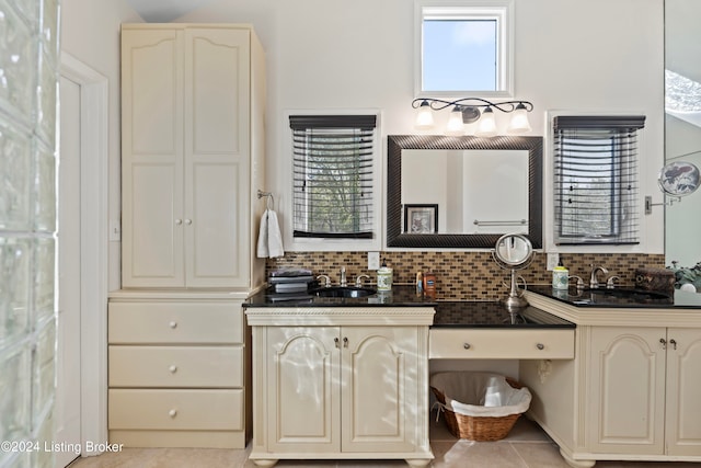 bathroom with backsplash, vanity, and tile patterned floors