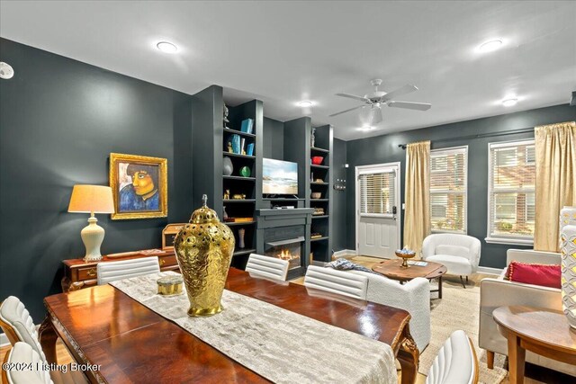 interior space featuring built in features and ceiling fan