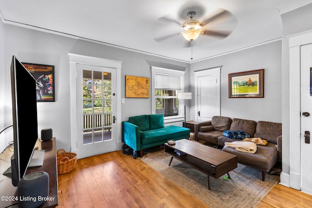 living room featuring light wood-type flooring and ceiling fan