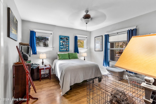 bedroom featuring ceiling fan and hardwood / wood-style flooring