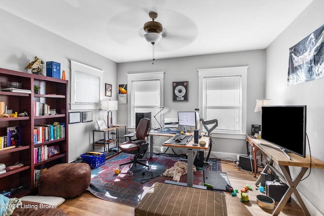 office featuring light wood-type flooring and ceiling fan