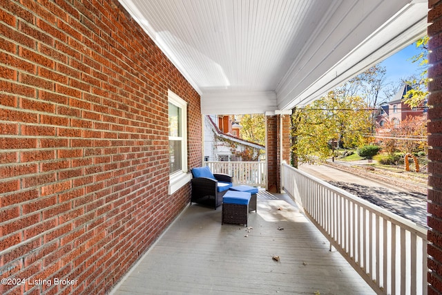 wooden terrace featuring a porch