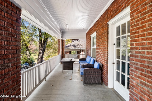 wooden deck featuring an outdoor hangout area