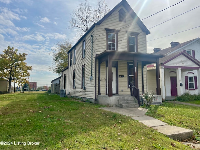 front facade with a front yard and central AC unit