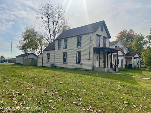 view of home's exterior featuring a yard and covered porch