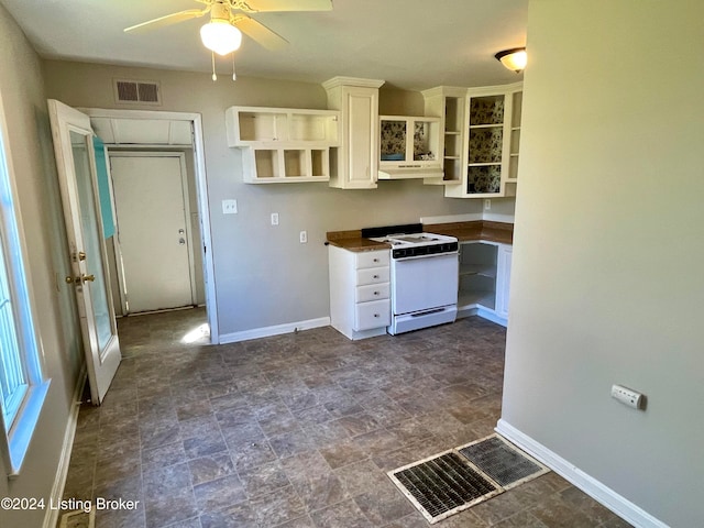 kitchen with ceiling fan, white range with electric cooktop, and white cabinets