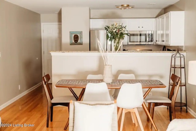 dining room featuring light hardwood / wood-style floors