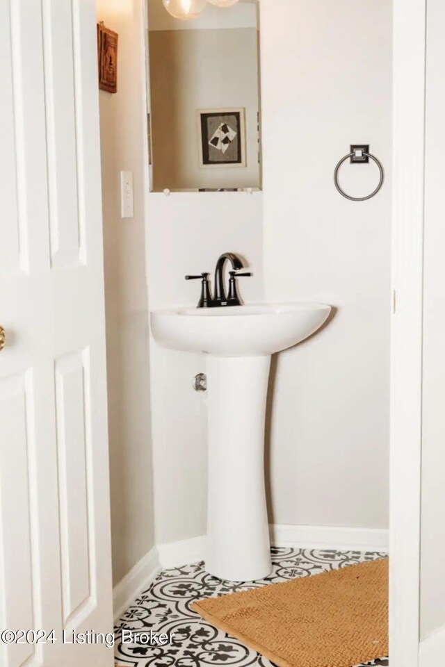 bathroom with tile patterned flooring