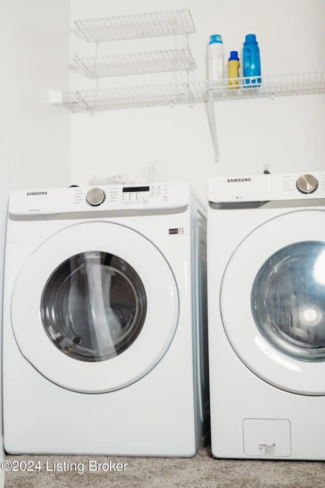 clothes washing area featuring washing machine and dryer