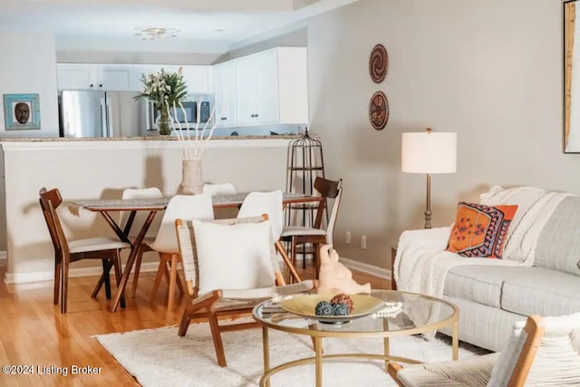 living room with light hardwood / wood-style flooring