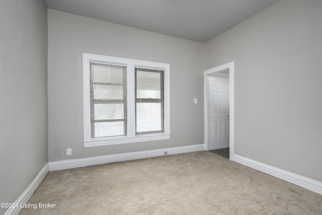 empty room with light colored carpet