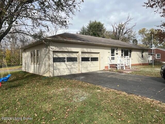 exterior space with a garage and a front yard