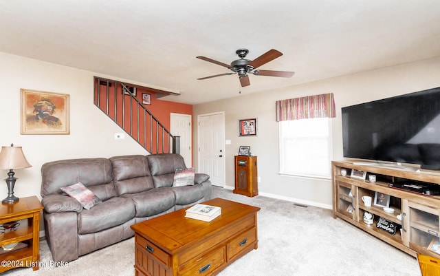 living room featuring ceiling fan and light colored carpet