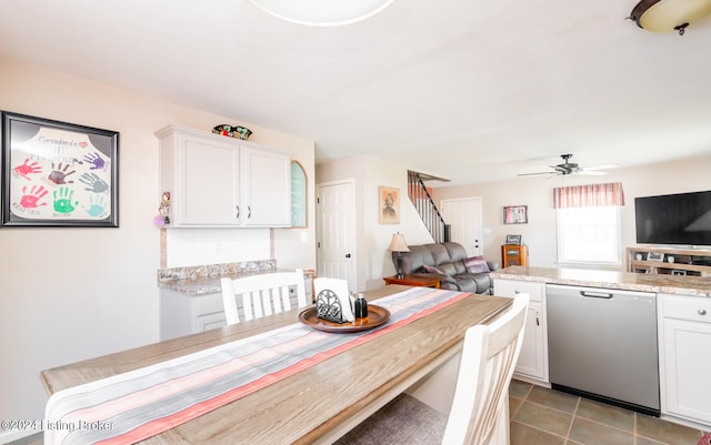 dining room featuring ceiling fan and light tile patterned floors