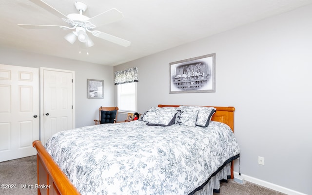 carpeted bedroom with a closet and ceiling fan