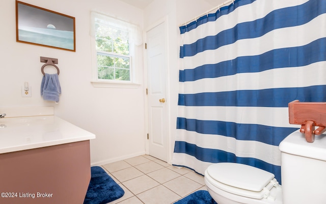 bathroom featuring toilet, vanity, and tile patterned floors