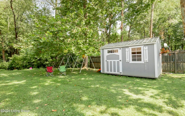 view of outbuilding featuring a yard