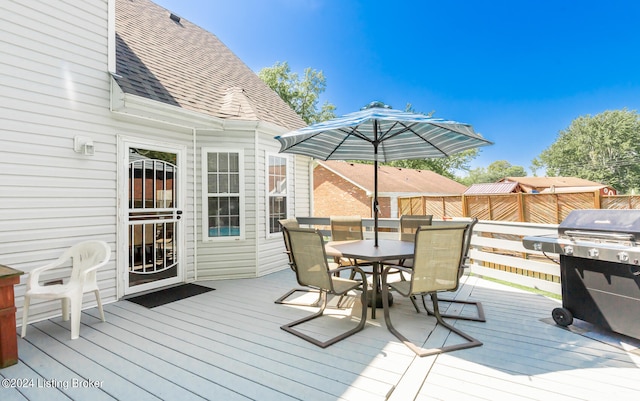 wooden terrace with grilling area