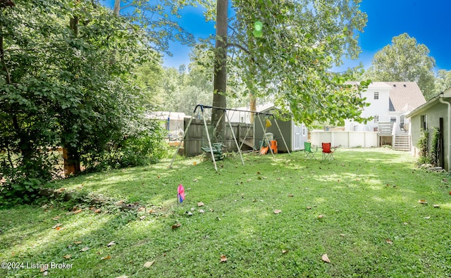 view of yard with a storage unit