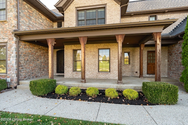 property entrance with covered porch