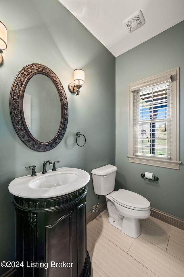 bathroom with vanity and toilet