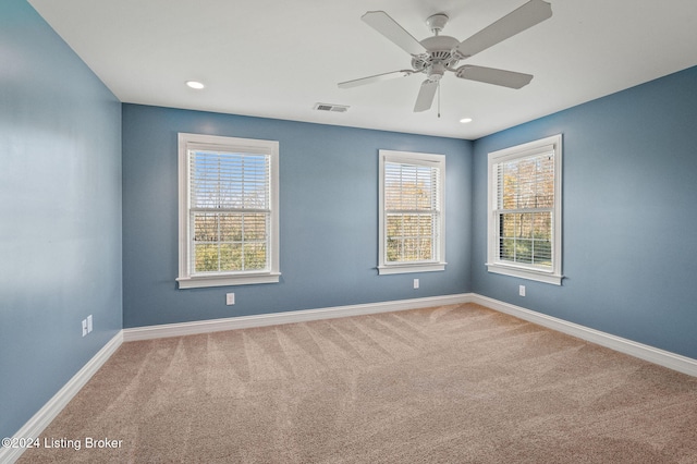 unfurnished room featuring carpet flooring and ceiling fan