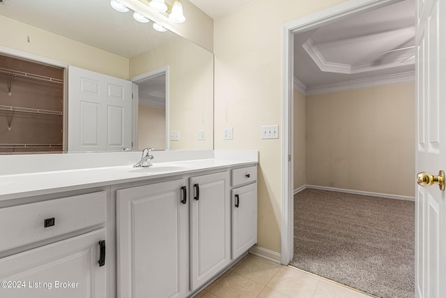 bathroom with ornamental molding, tile patterned flooring, and vanity