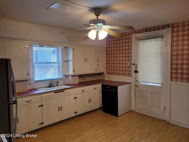 kitchen featuring dishwasher, sink, light hardwood / wood-style flooring, and fridge