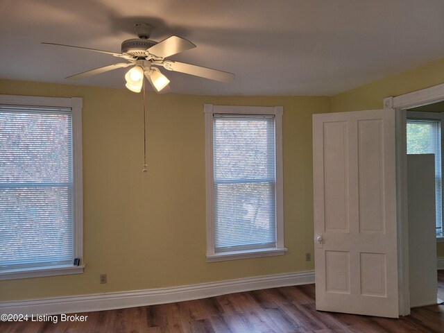 interior space featuring ceiling fan and dark hardwood / wood-style floors