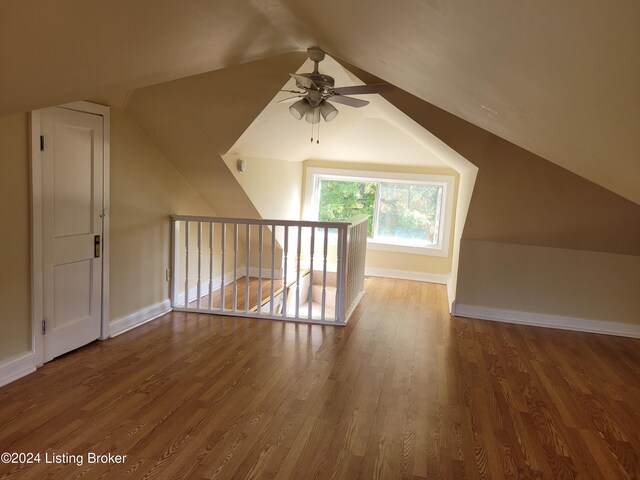 bonus room with ceiling fan, wood-type flooring, and vaulted ceiling