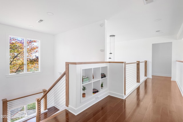 hall with hardwood / wood-style flooring