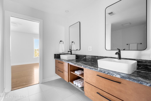 bathroom with hardwood / wood-style floors and vanity