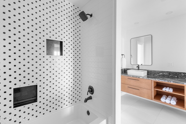 bathroom with vanity, tile patterned floors, and tiled shower / bath combo