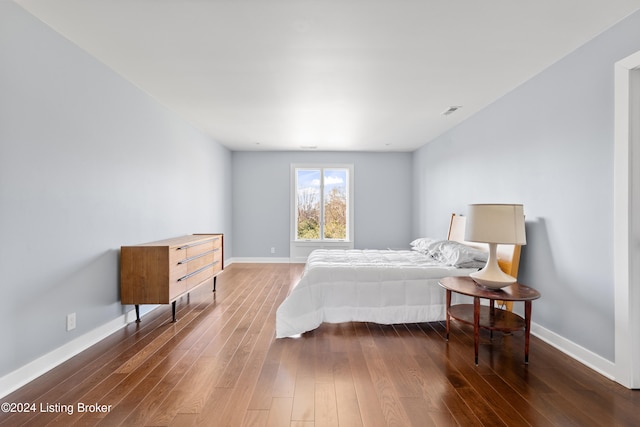 bedroom featuring dark wood-type flooring