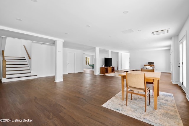 dining area with dark wood-type flooring and a wealth of natural light