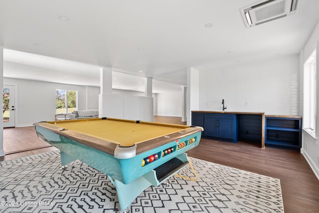 game room with pool table, hardwood / wood-style floors, and sink