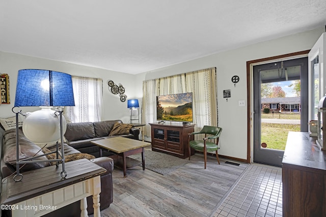 living room featuring light wood-style floors and baseboards