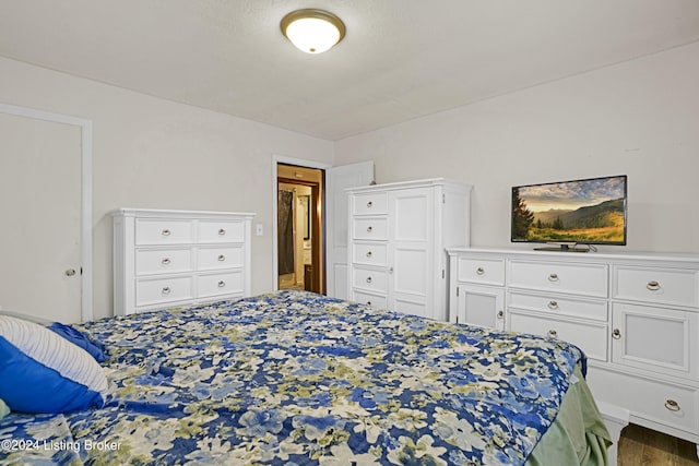 bedroom with wood finished floors