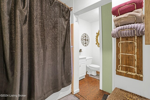 bathroom with toilet and vanity