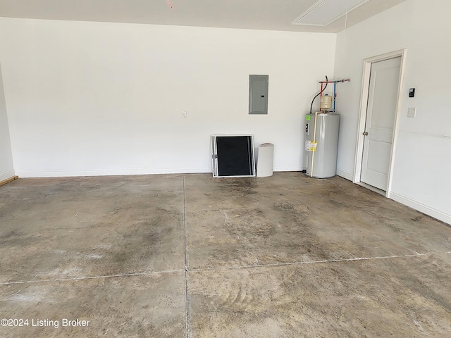 garage featuring electric panel and electric water heater