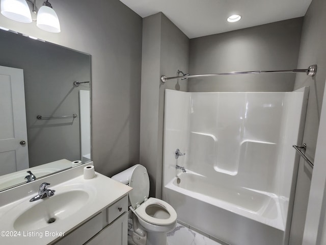 full bathroom with vanity, shower / tub combination, and toilet