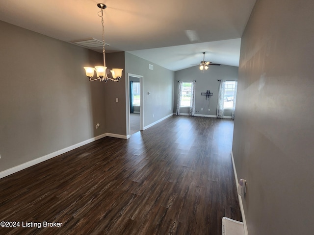 unfurnished living room featuring ceiling fan with notable chandelier, dark hardwood / wood-style flooring, and vaulted ceiling