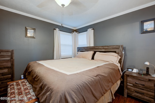 bedroom with ornamental molding, ceiling fan, and dark hardwood / wood-style floors