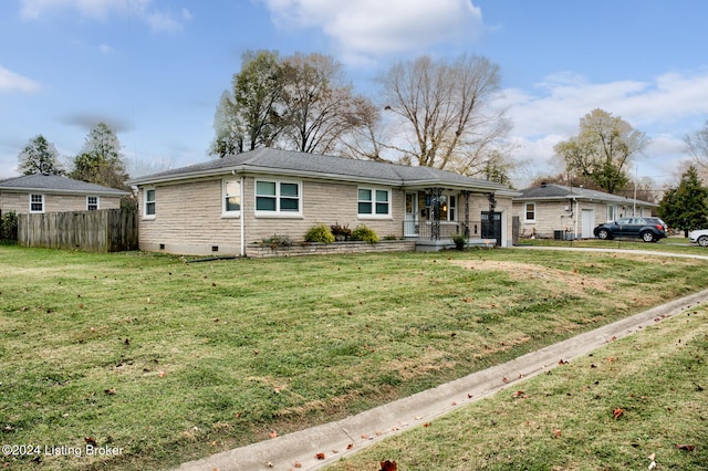 ranch-style house featuring a front lawn