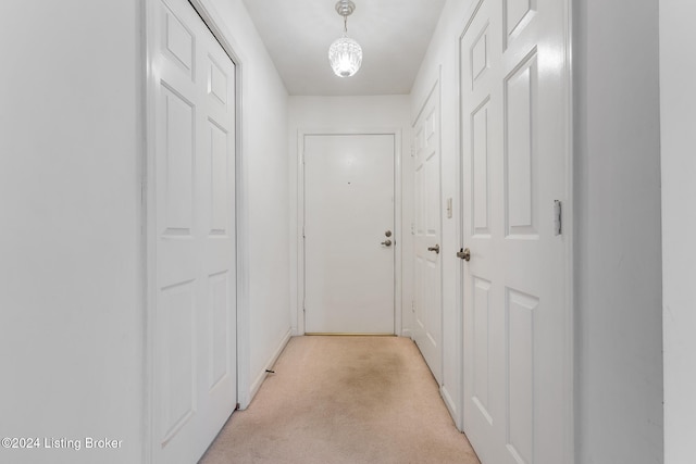 corridor with light colored carpet