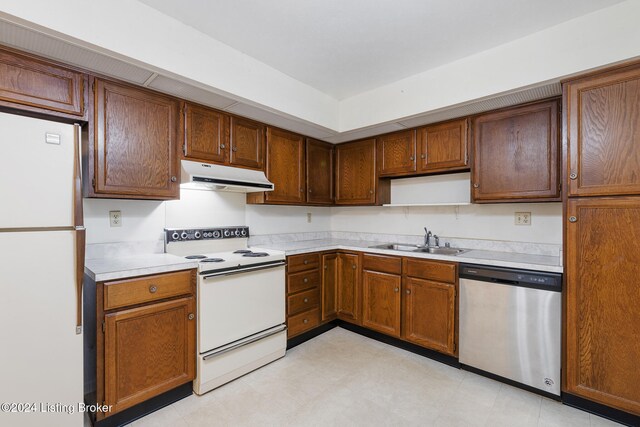 kitchen with white appliances and sink