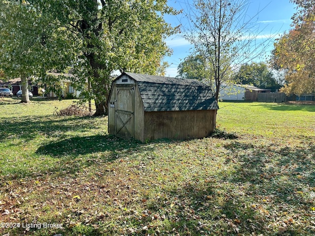 view of outbuilding featuring a lawn